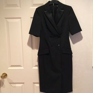 A form fitting tuxedo cocktail dress